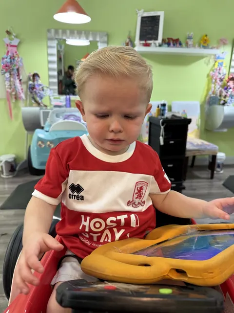 Boy haircut at Sparkles and Spikes kids salon #043