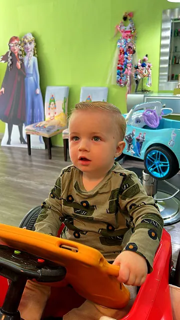 First haircut moment at Sparkles and Spikes kids salon #005