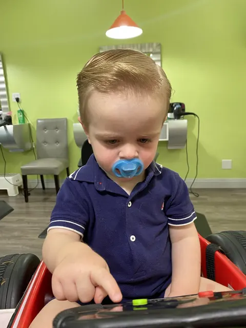 First haircut moment at Sparkles and Spikes kids salon #081