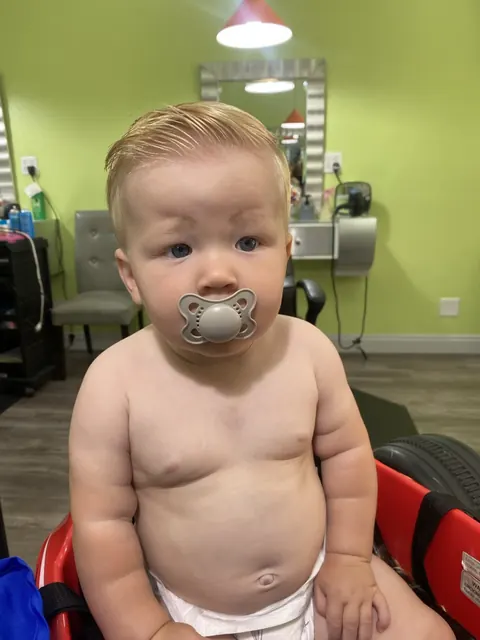 First haircut moment at Sparkles and Spikes kids salon #093